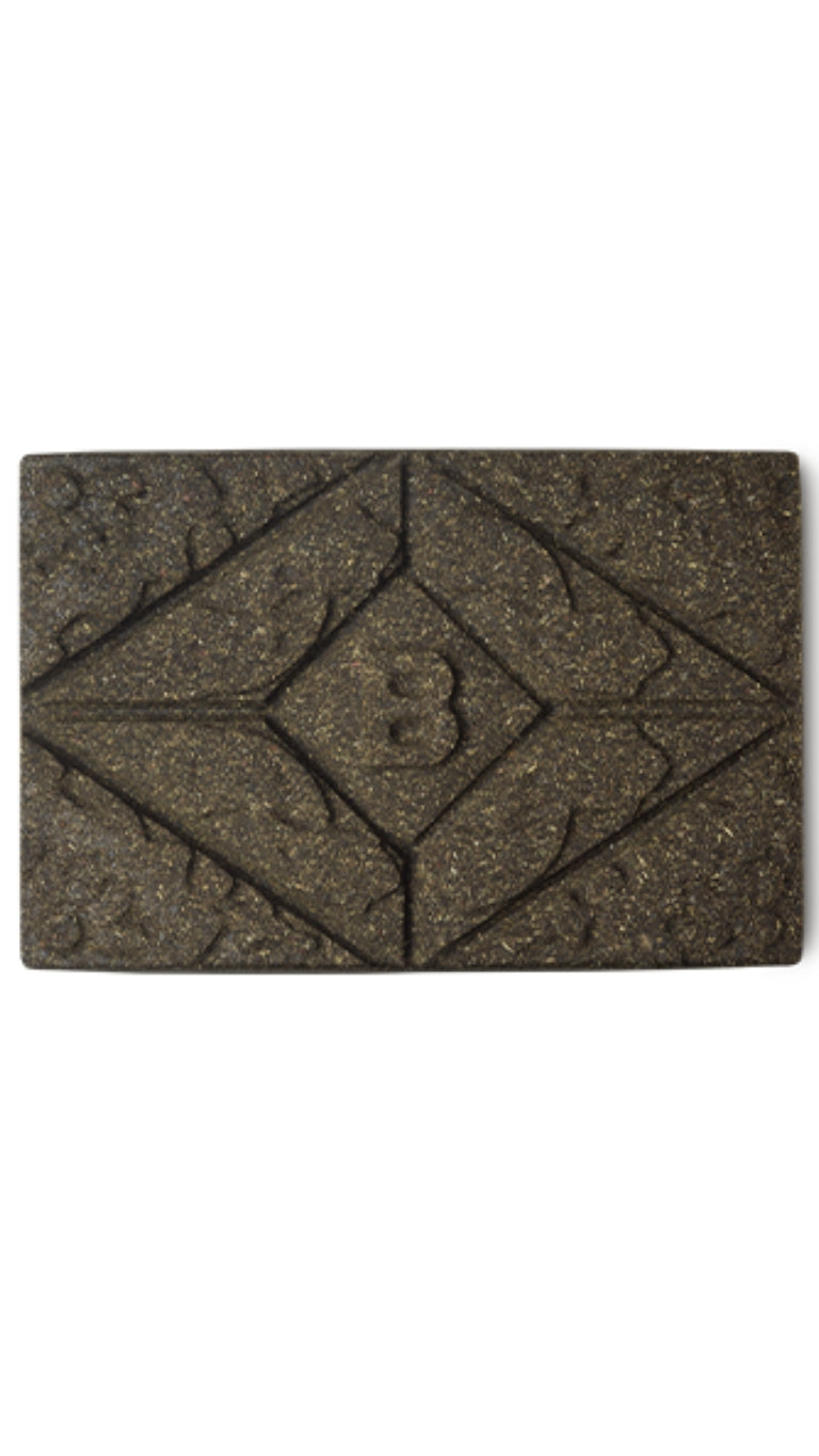 A brown rectangular block of lush henna hair dye.
