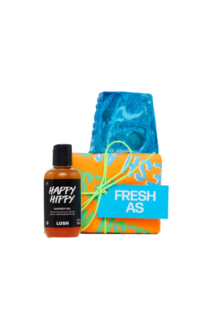 Fresh As gift featuring Happy Hippy shower gel and Outback Mate soap piece displayed around a vibrant orange wrapped gift box.