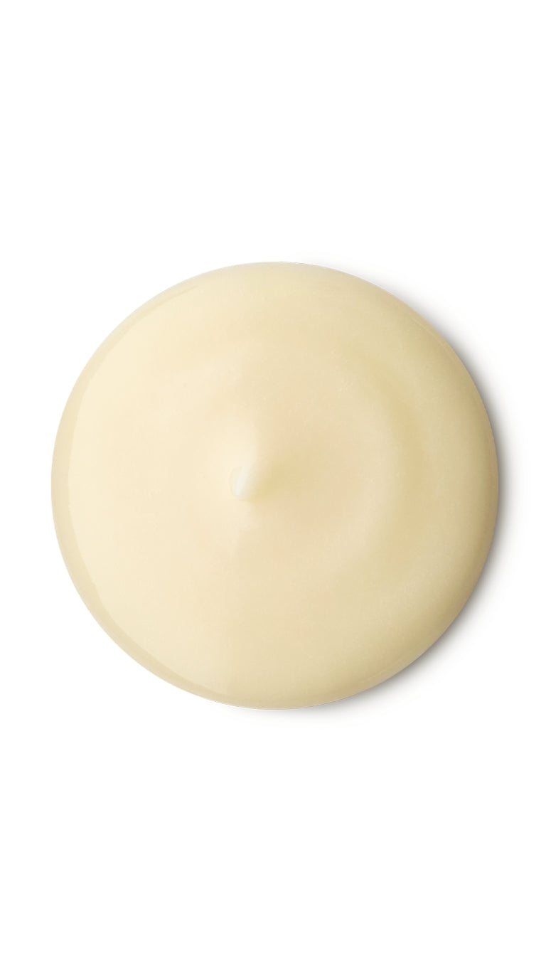 A cream circular swatch of a lush shower gel.