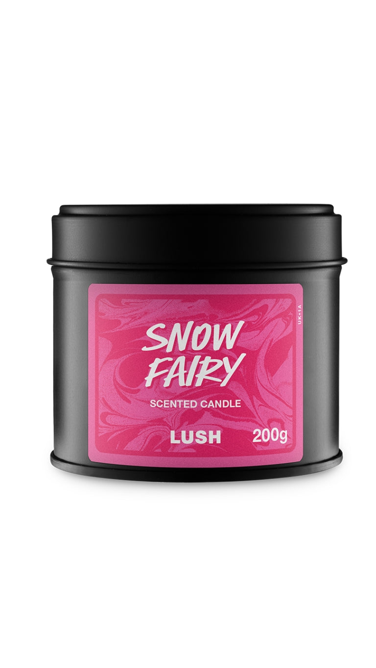 A lack round tin of Snow Fairy candle with a dark and light pink marbled lable with the name printed in white.