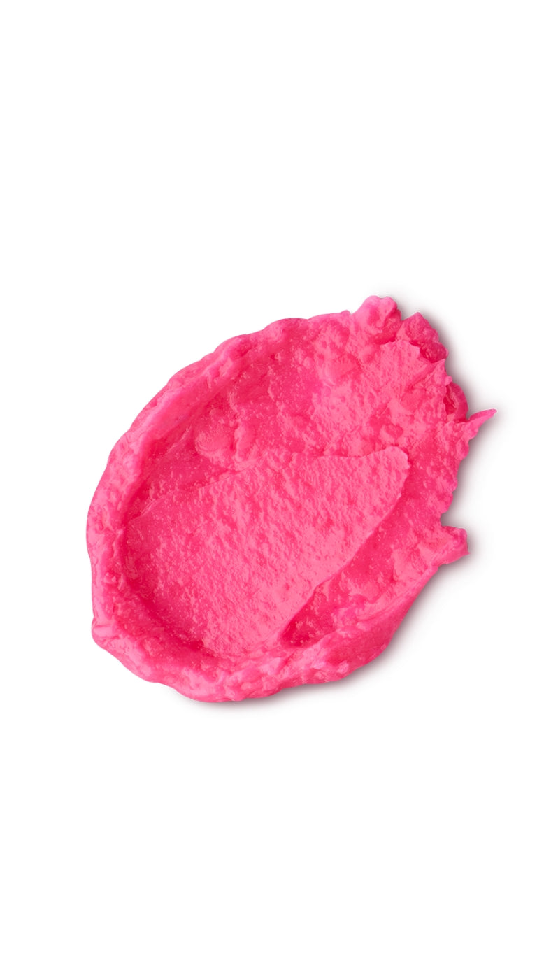 A pink circular swatch of a lush tinted lip balm.