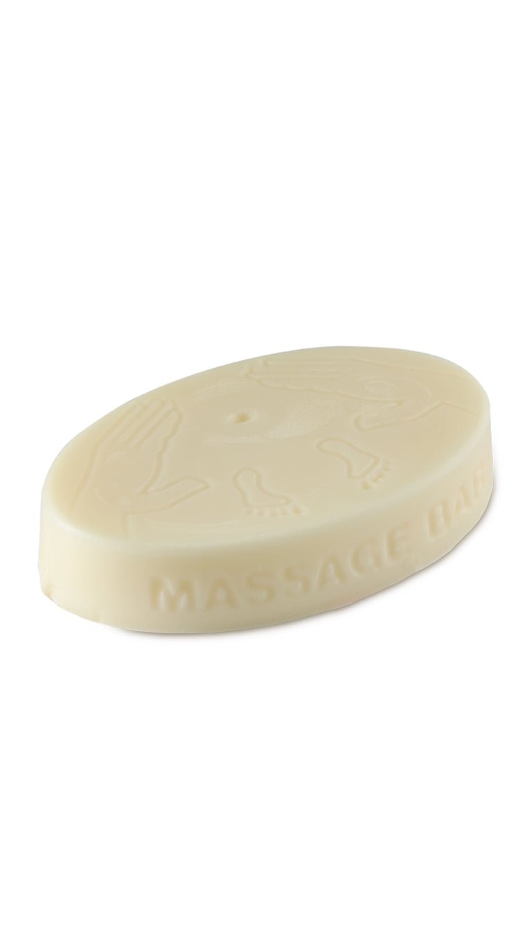 A cream oval-shaped lush massage bar.