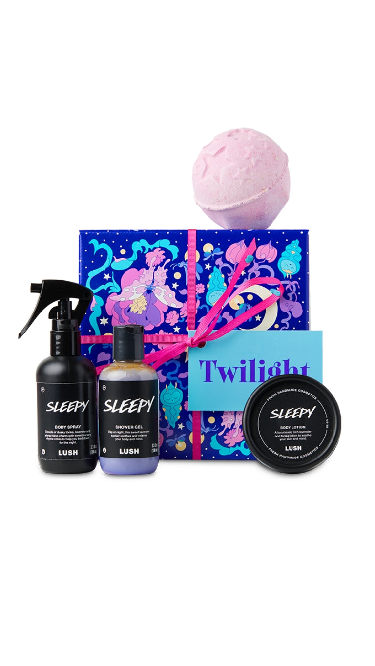 Twilight Gift featuring Sleepy body spray, Sleepy shower gel, Sleep body lotion, and Twilight bath bomb displayed around a graphic colourful hat box.