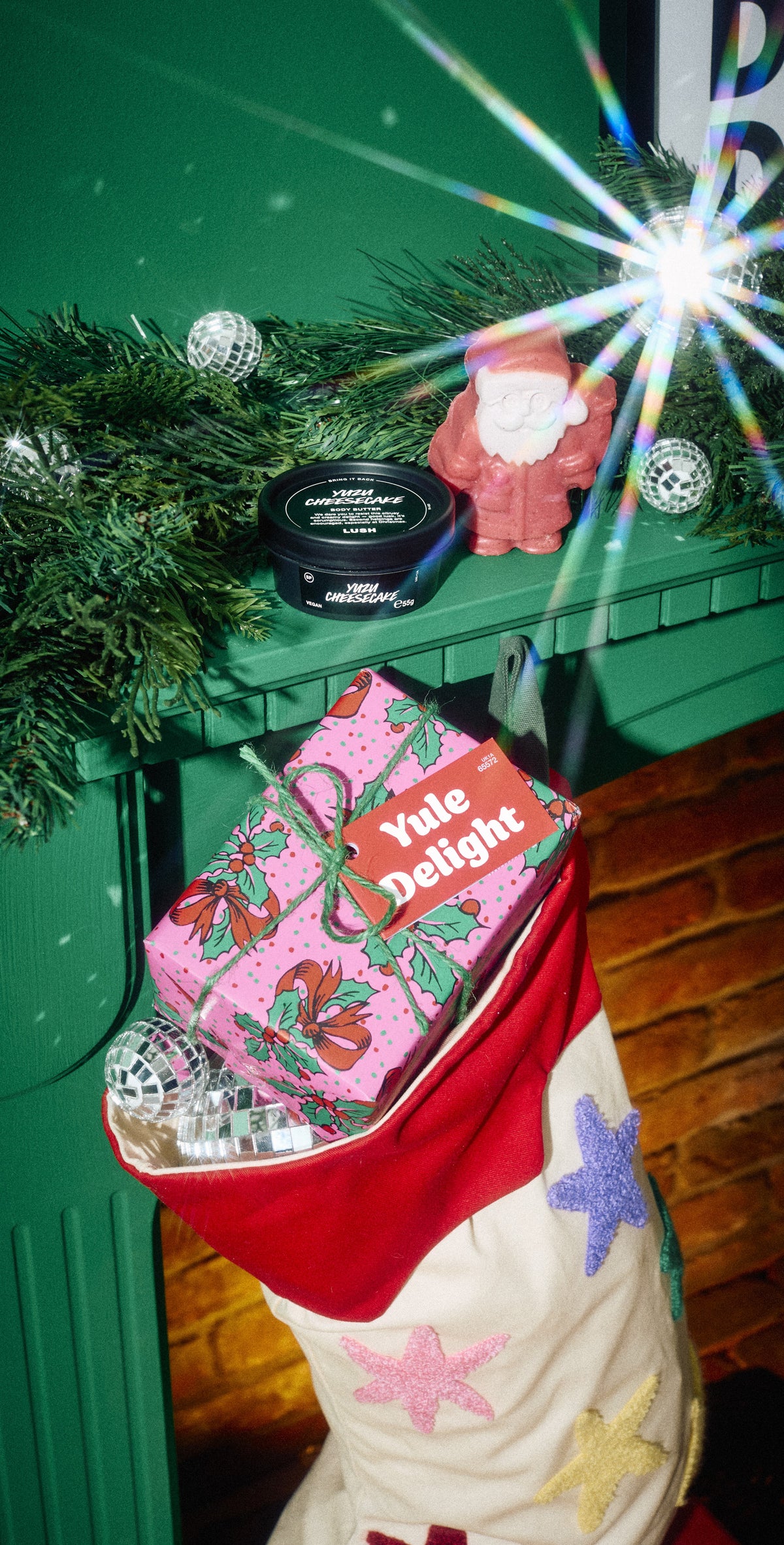 Yule Delight wrapped gift in a Christmas stocking, with a pot and solid product on the mantelpiece above.