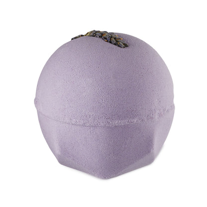 The One With Lavender. A Classic LUSH-shaped bath bomb in a delicate, pastel purple colour. There is a sprig of dried lavender embedded on top.