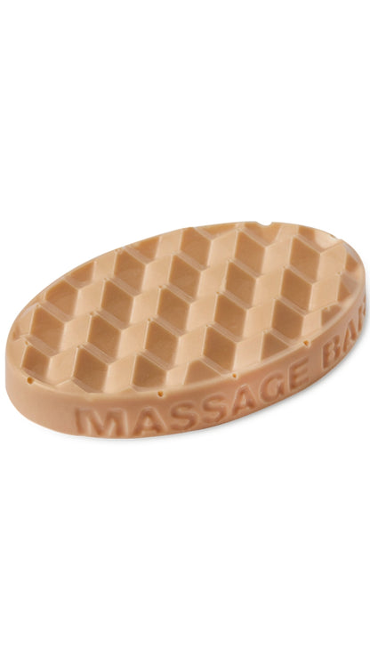 A clay coloured oval-shaped lush massage bar that smells zesty. 