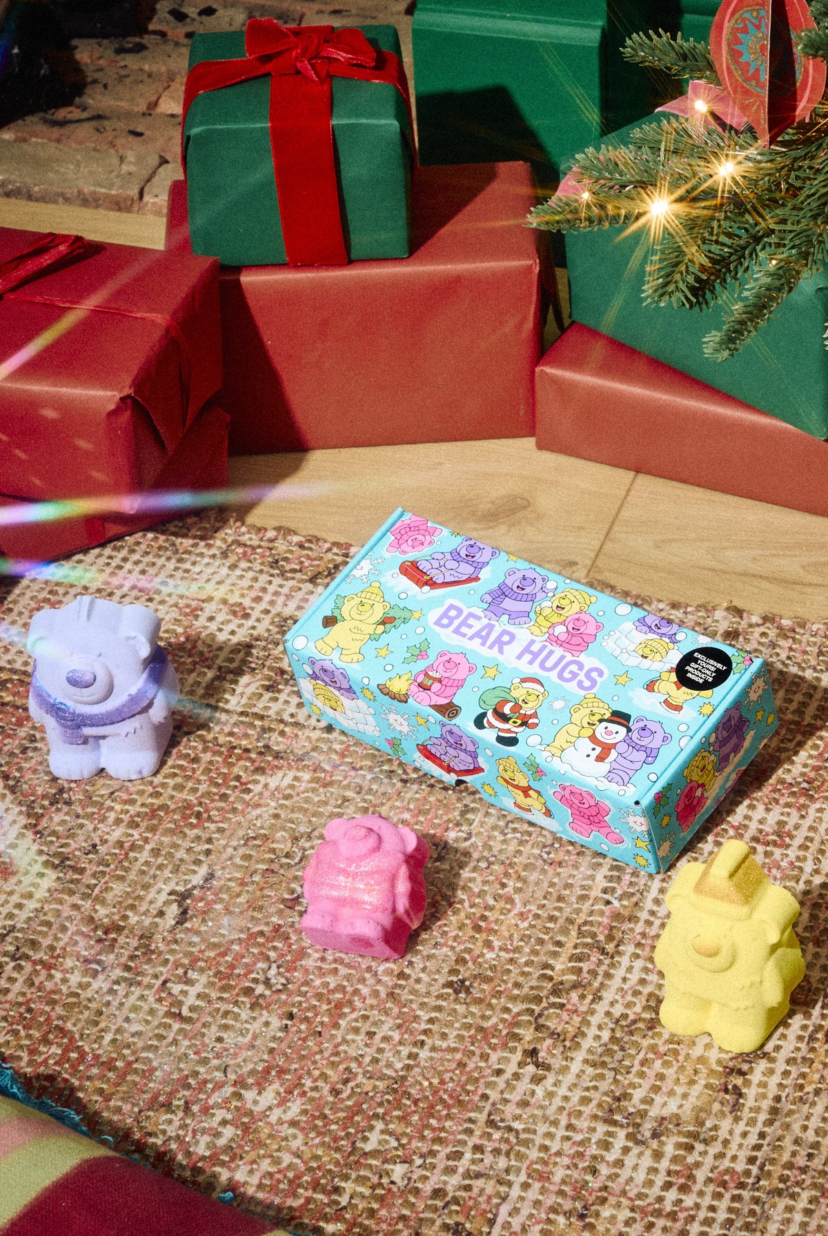 Bear Hugs gift box displayed with purple, pink and yellow bear-shaped products.