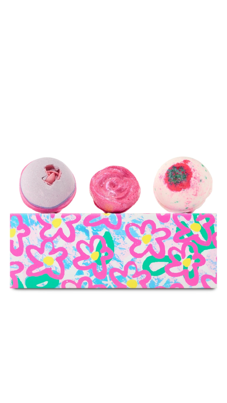 Blooming Beautiful gift featuring Sex Bomb and Equity (formerly known as Sakura) bath bombs, and Rose Jam Bubbleroon displayed on the top of a floral patterned slide gift box. 