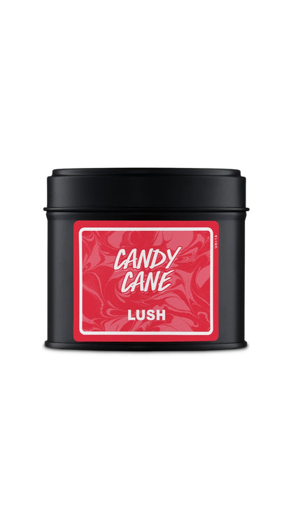 A black tin with the red label on it. 