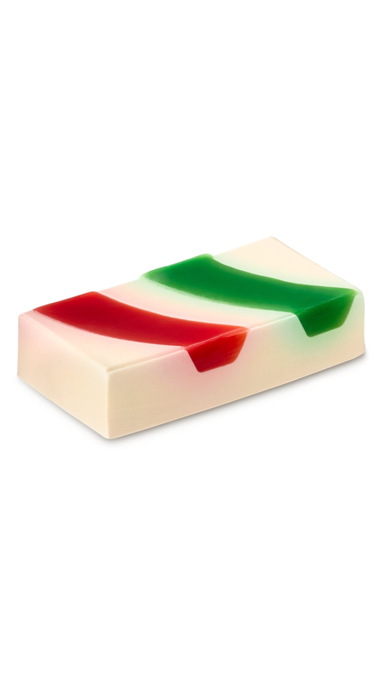A red, green and white rectangular shaped soap piece. 