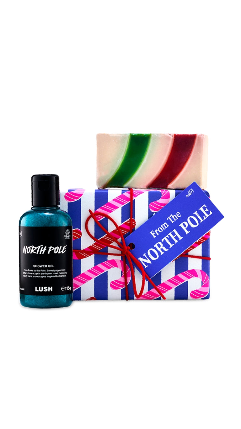From the North Pole gift featuring Candy Cane soap piece and North Pole shower gel, displayed in front of a candy cane wrapped box. 