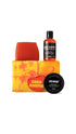 Good Karma Gift featuring Karma soap piece, Orange body scrub and Good Karma, Everybody Needs Some shower gel displayed around a vibrant tie-dyed wrapped gift box. 