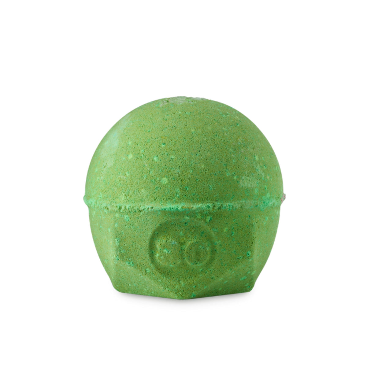 A green circular lush bomb with salt on the top that smells like citrus. 