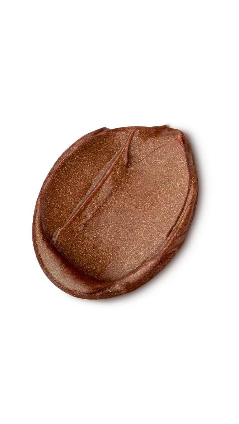 A brown circular swatch of a lush lip mask. 