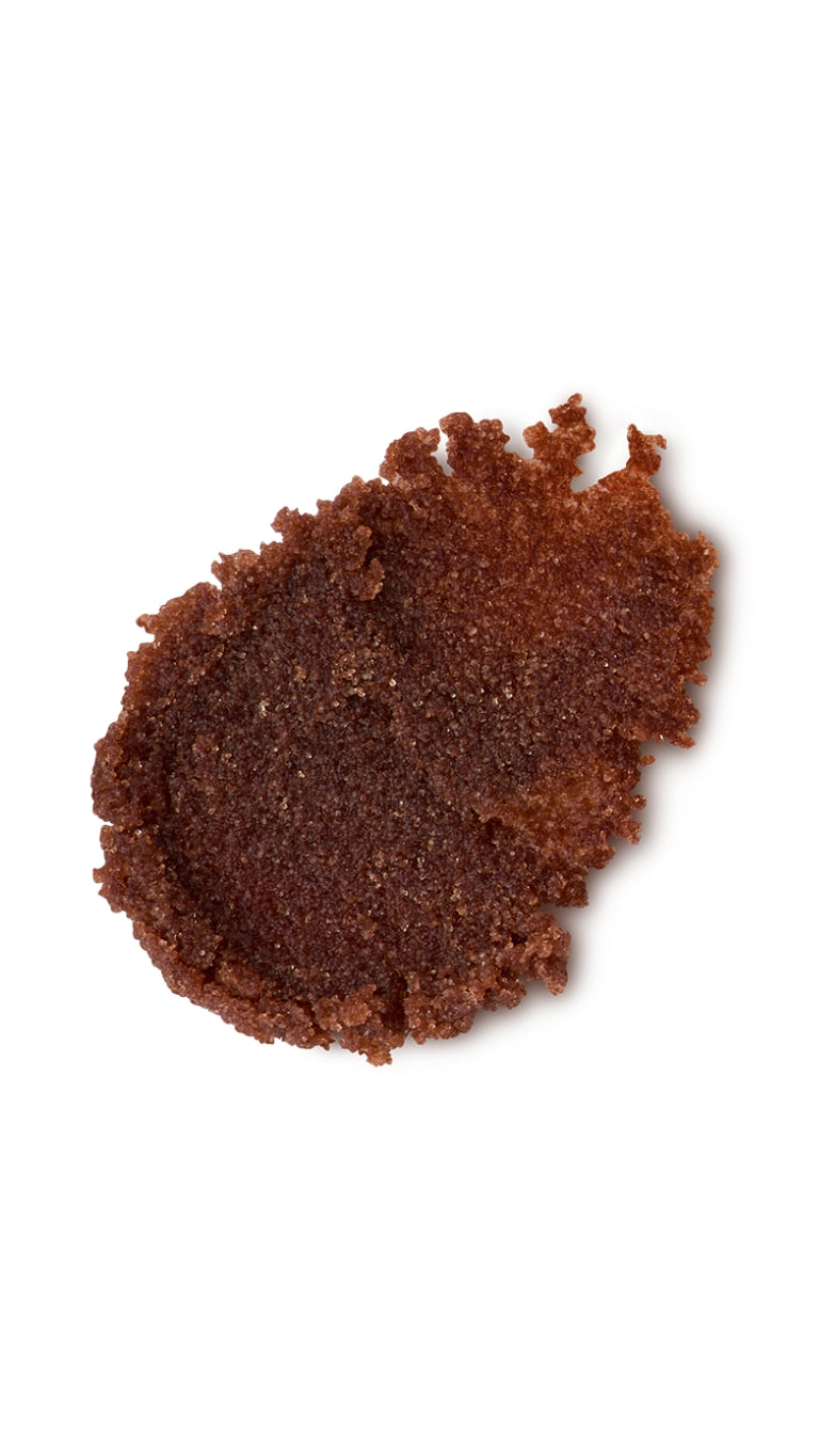 A brown tear-shaped swatch of a lush sugar lip scrub. 