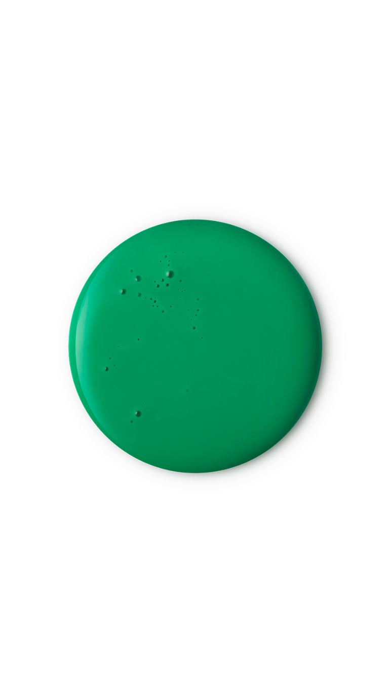 A green circular swatch of a lush seasonal shower gel. 