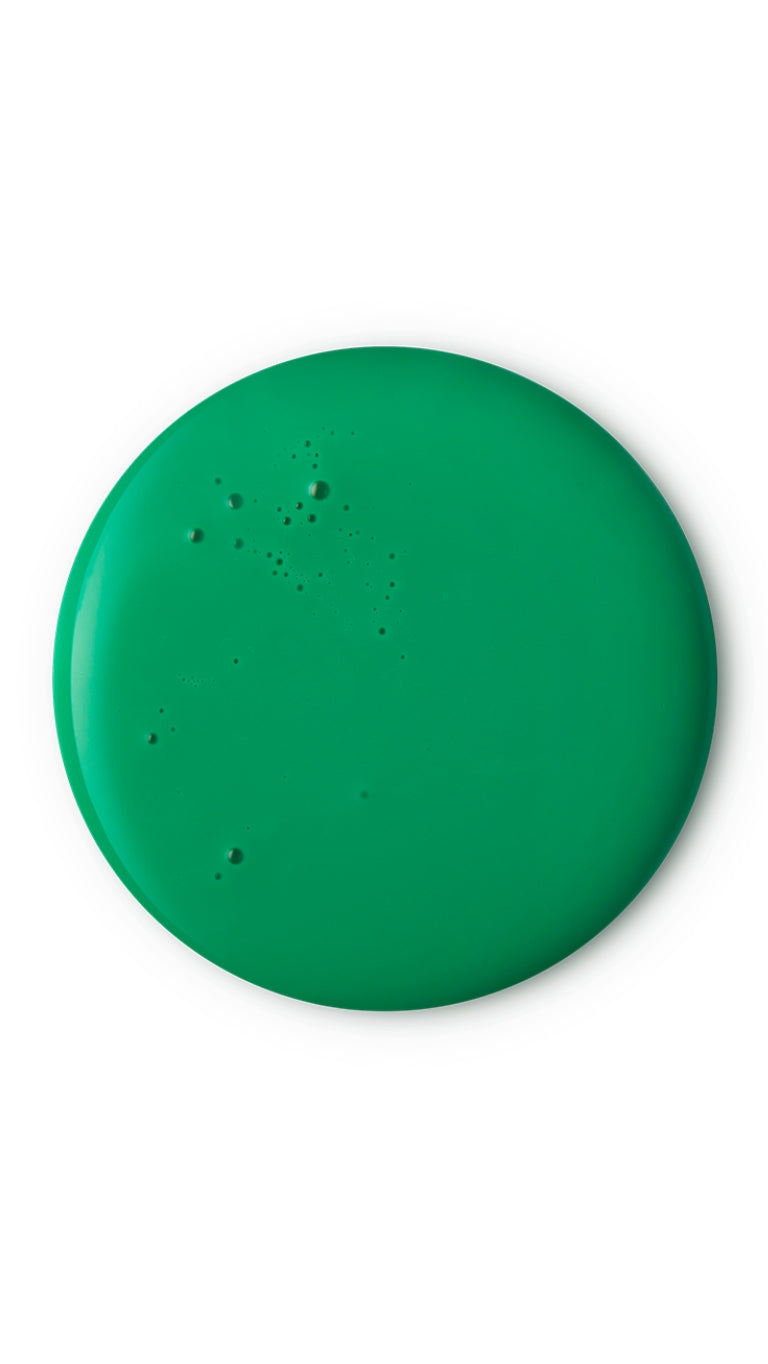 A green circular swatch of a lush seasonal shower gel.
