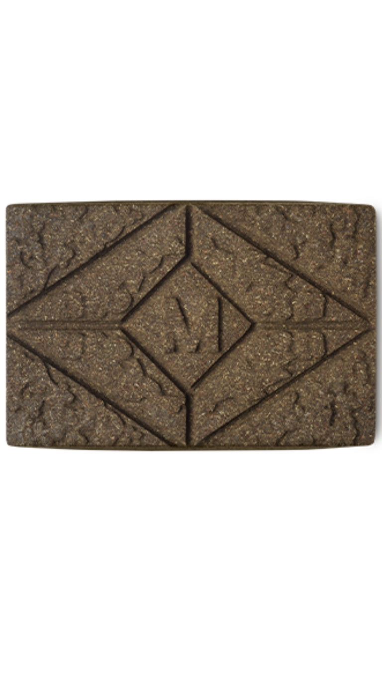 A brown rectangular block of lush henna hair dye. 