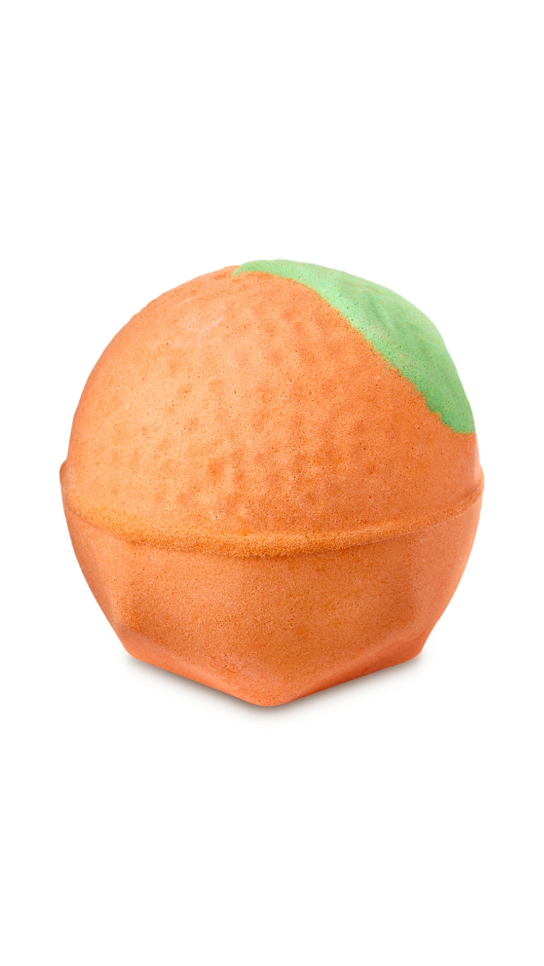 An orange-shaped bath bomb with a green leaf. 