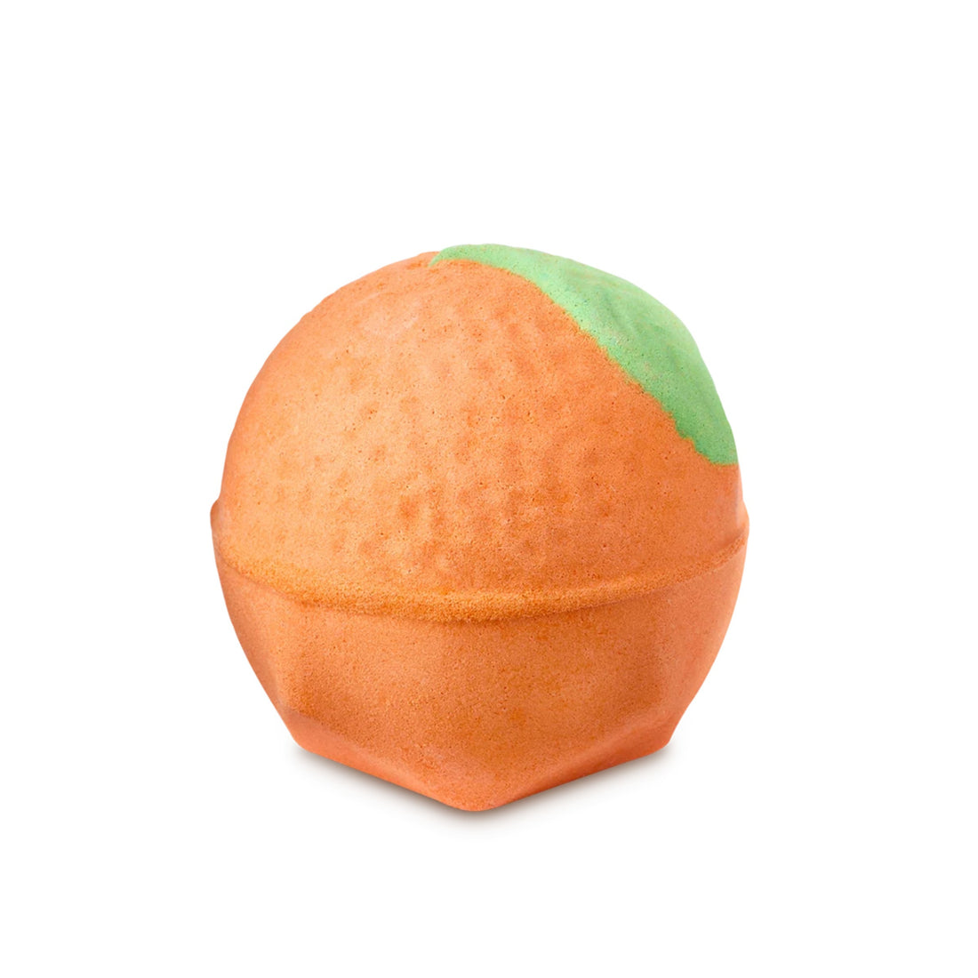 An orange-shaped bath bomb with a green leaf. 