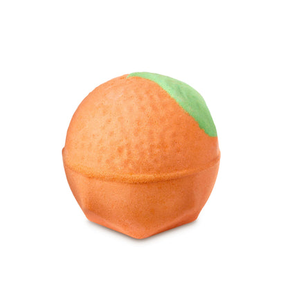 An orange-shaped bath bomb with a green leaf. 