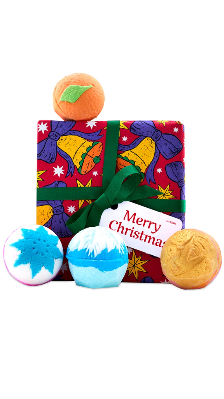 Merry Christmas gift featuring four festive bath bombs displayed around a graphic bell wrapped gift box. 