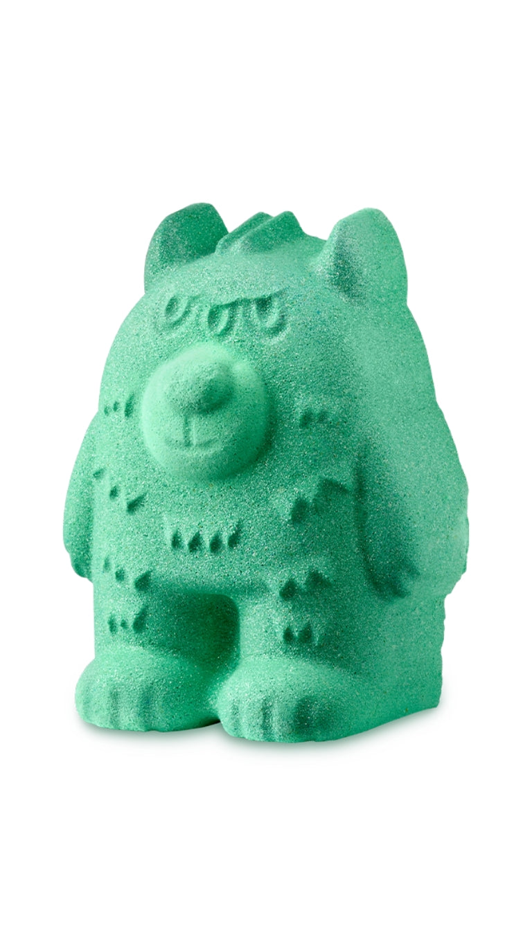 A green bear-shaped lush bath bomb.