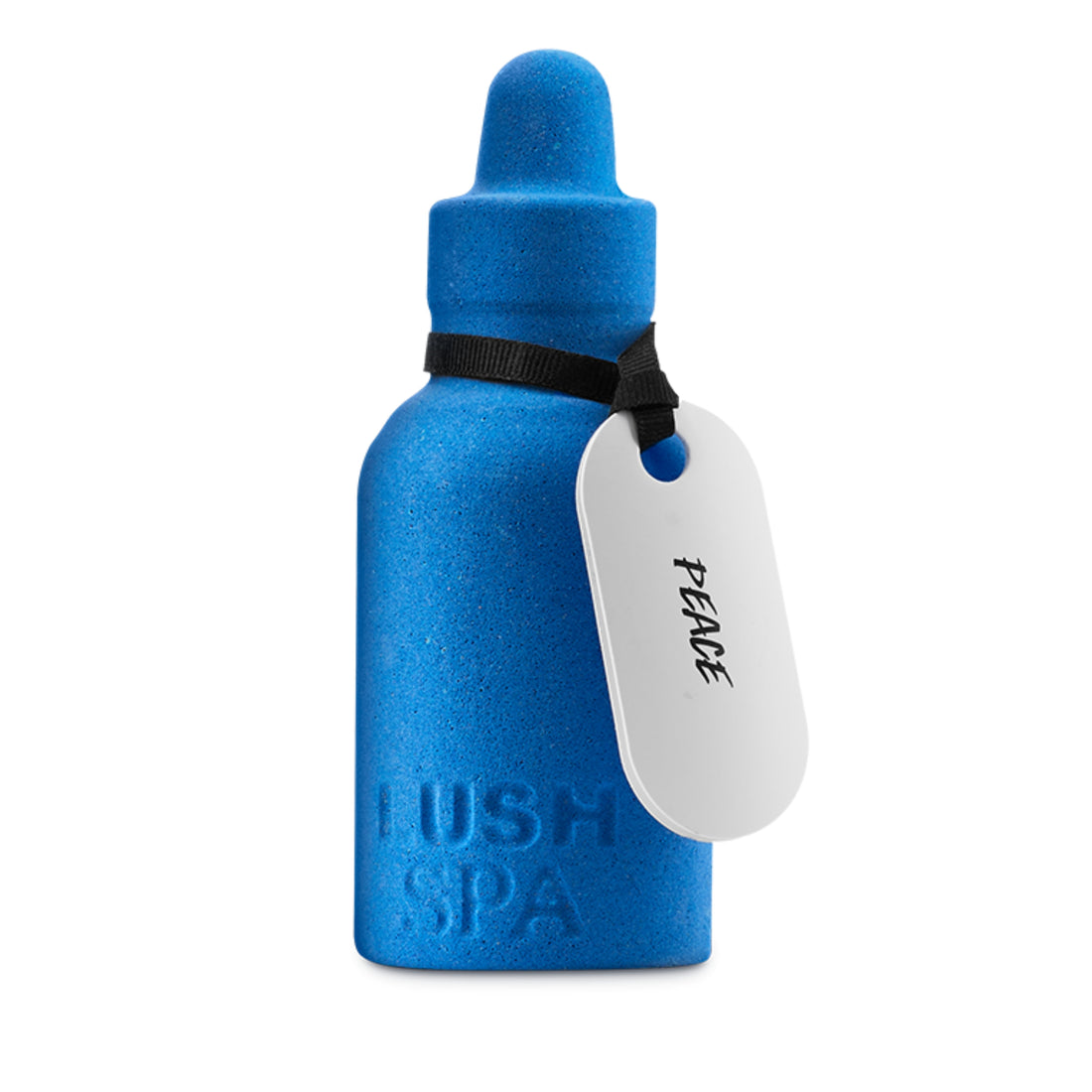 Blue bottle-shaped bath bomb with a white luggage tag attached by a black ribbon.