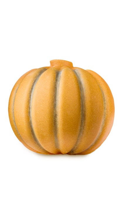 An orange pumpkin-shaped body butter and scrub. 