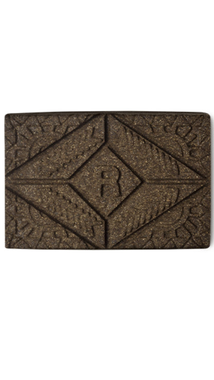 A brown rectangular block of lush henna hair dye. 