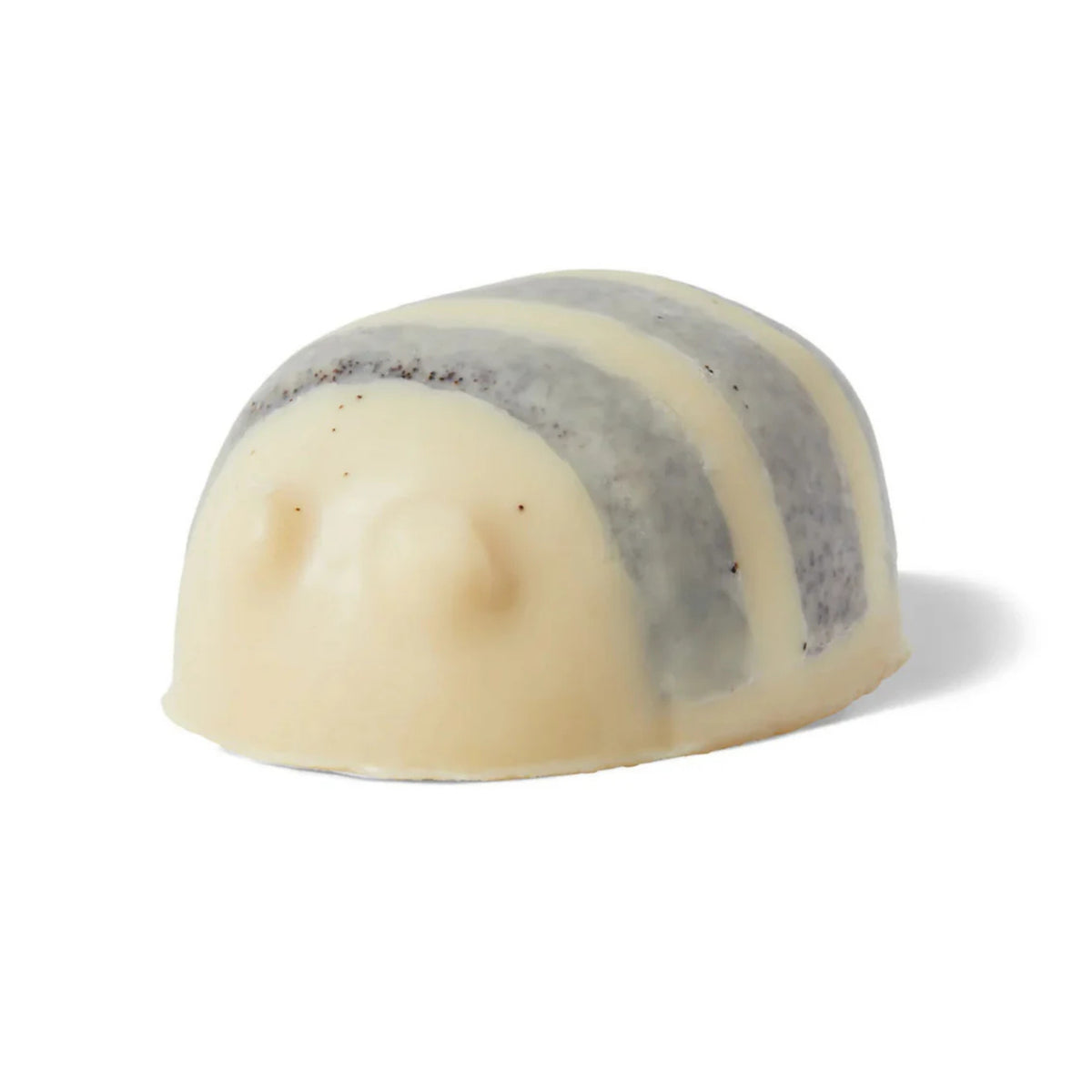 A cream and brown bee-shaped shower oil/ scrub with ground coconut inside that smells like honey. 