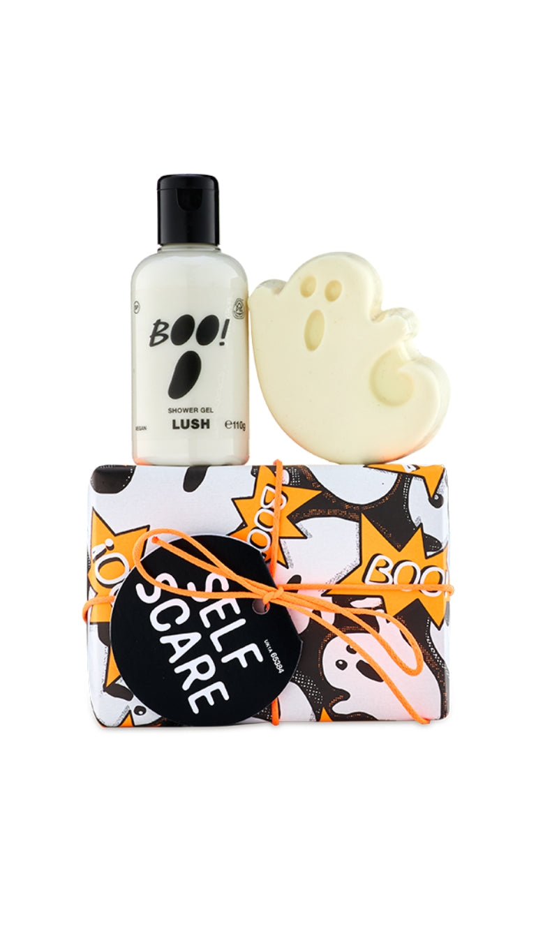 Self Scare gift set featuring Boo shower gel and Ghost Glow in the Dark soap piece displayed on top of a wrapped ghost patterned gift box. 