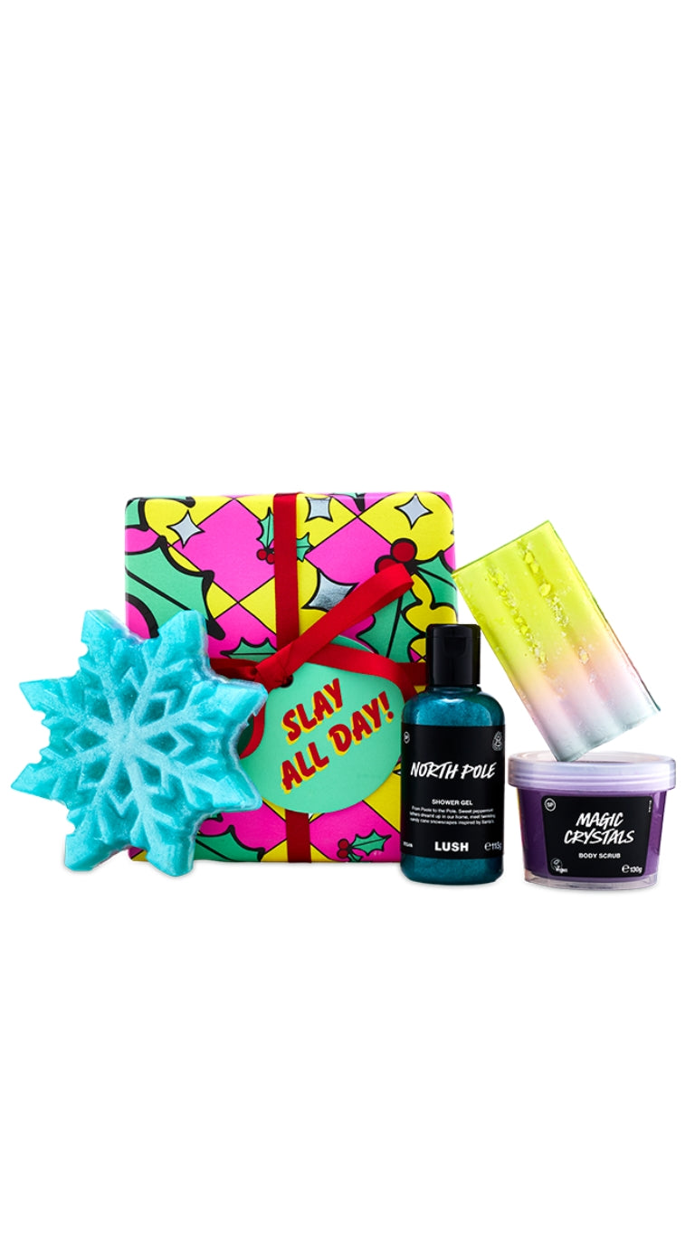 Slay All Day gift featuring seasonal festive products displayed in front of a graphic wrapped gift. 