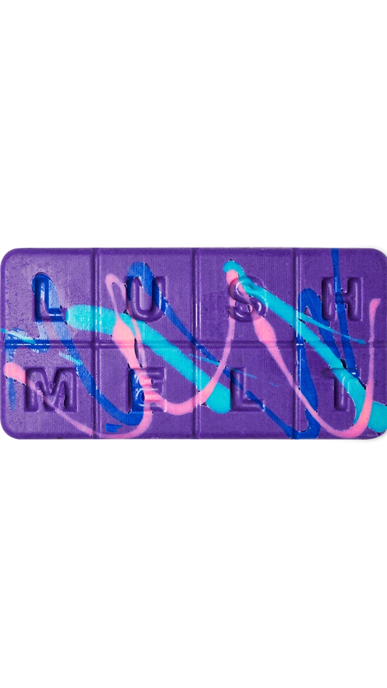 A purple, pink and blue marbled rectangular-shaped bath melt that smells like lavender. 