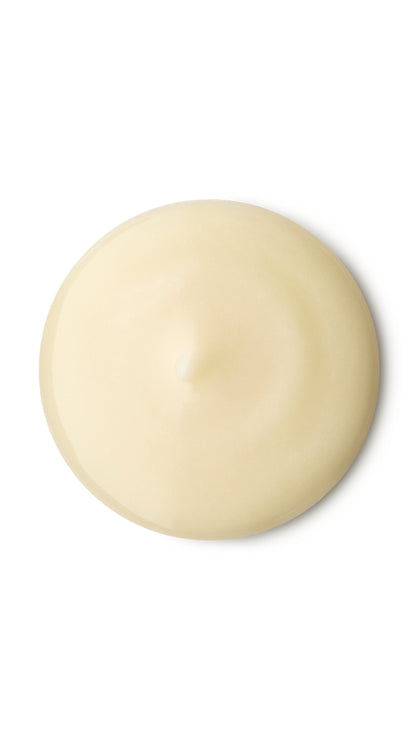 A cream circular swatch of a lush shower gel. 