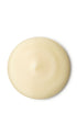 A cream circular swatch of a lush shower gel. 