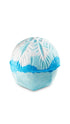 A blue circular bath bomb with a snow flake imprinted on the top. 