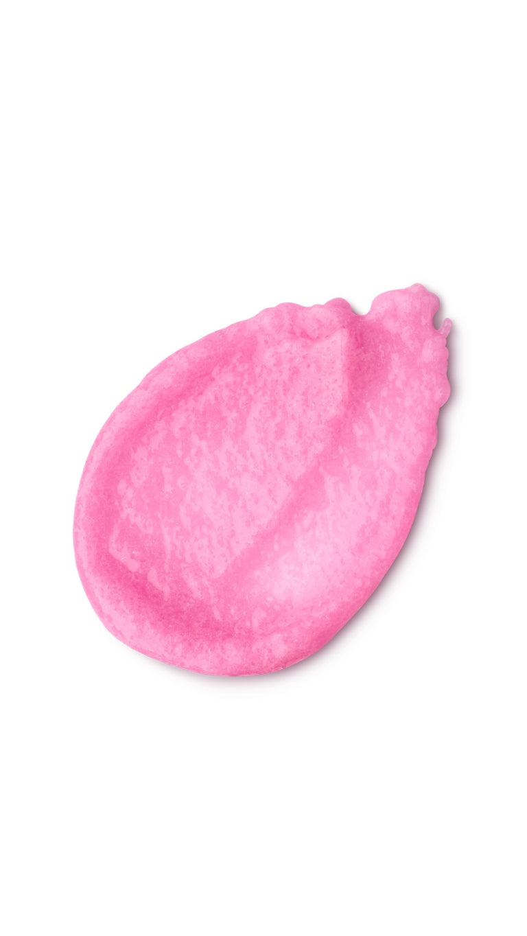 A pink tear-shaped swatch of a lush sugar scrub
