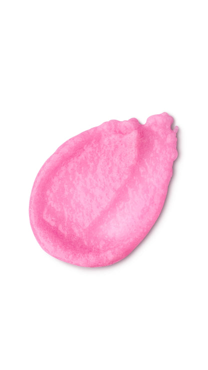 A pink tear-shaped swatch of a lush sugar scrub 