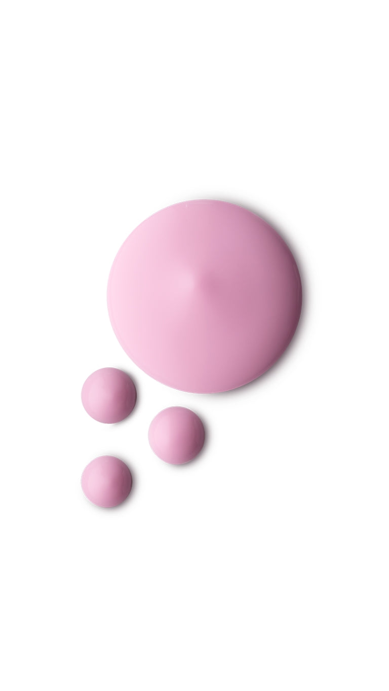 A pink circular swatch of a lush hair primer.