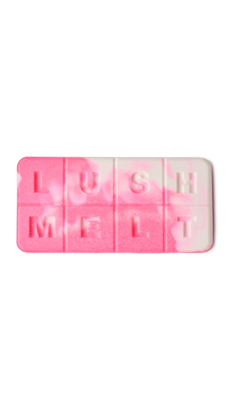 A pink and white marbled rectangular lush melt. 