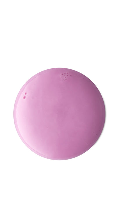 A pink circular swatch of a lush cream shower gel. 
