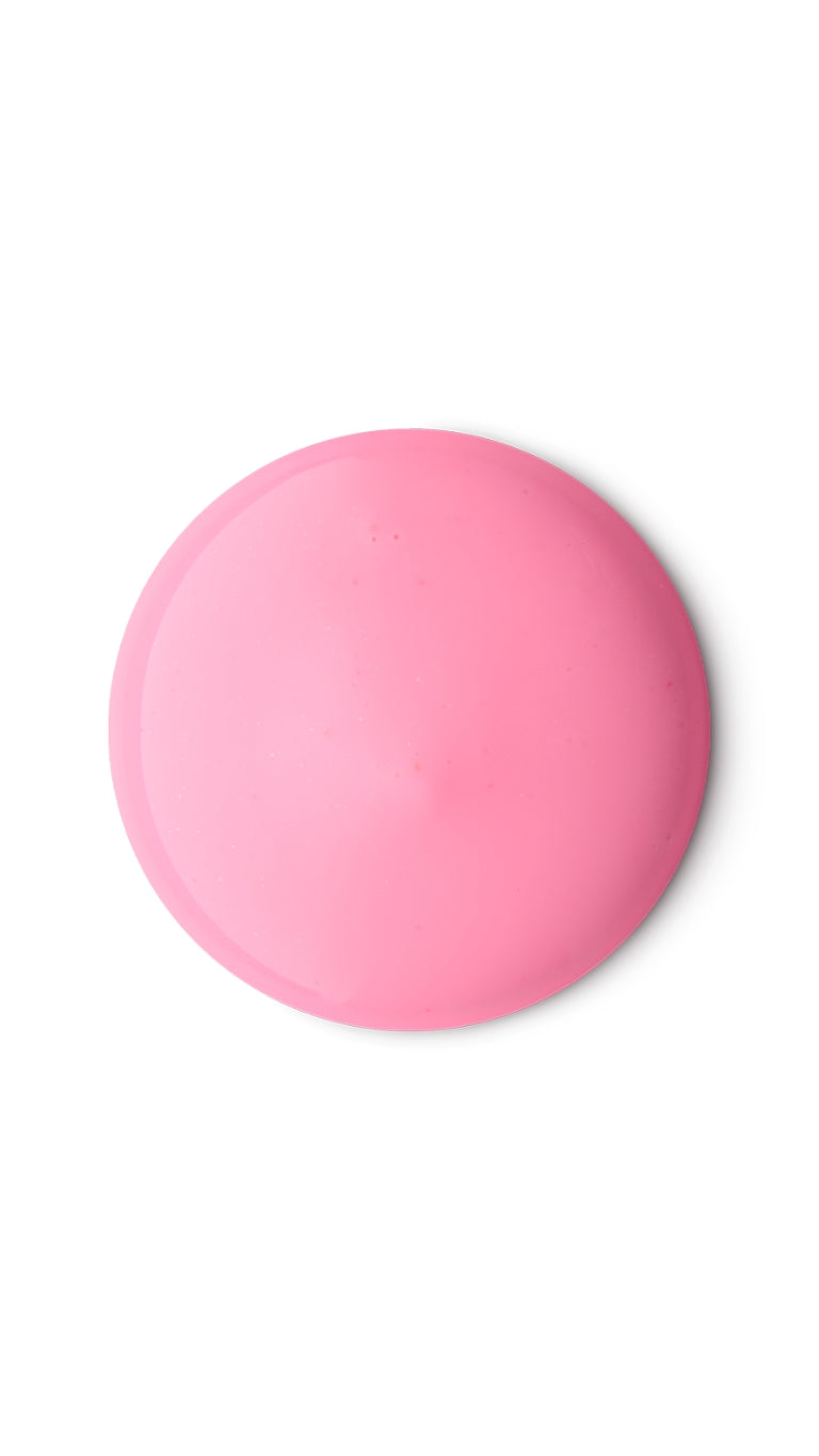 A pink circular swatch of a lush shower gel. 