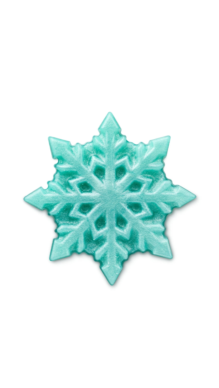 A blue snow flake shaped lush shower gummy. 