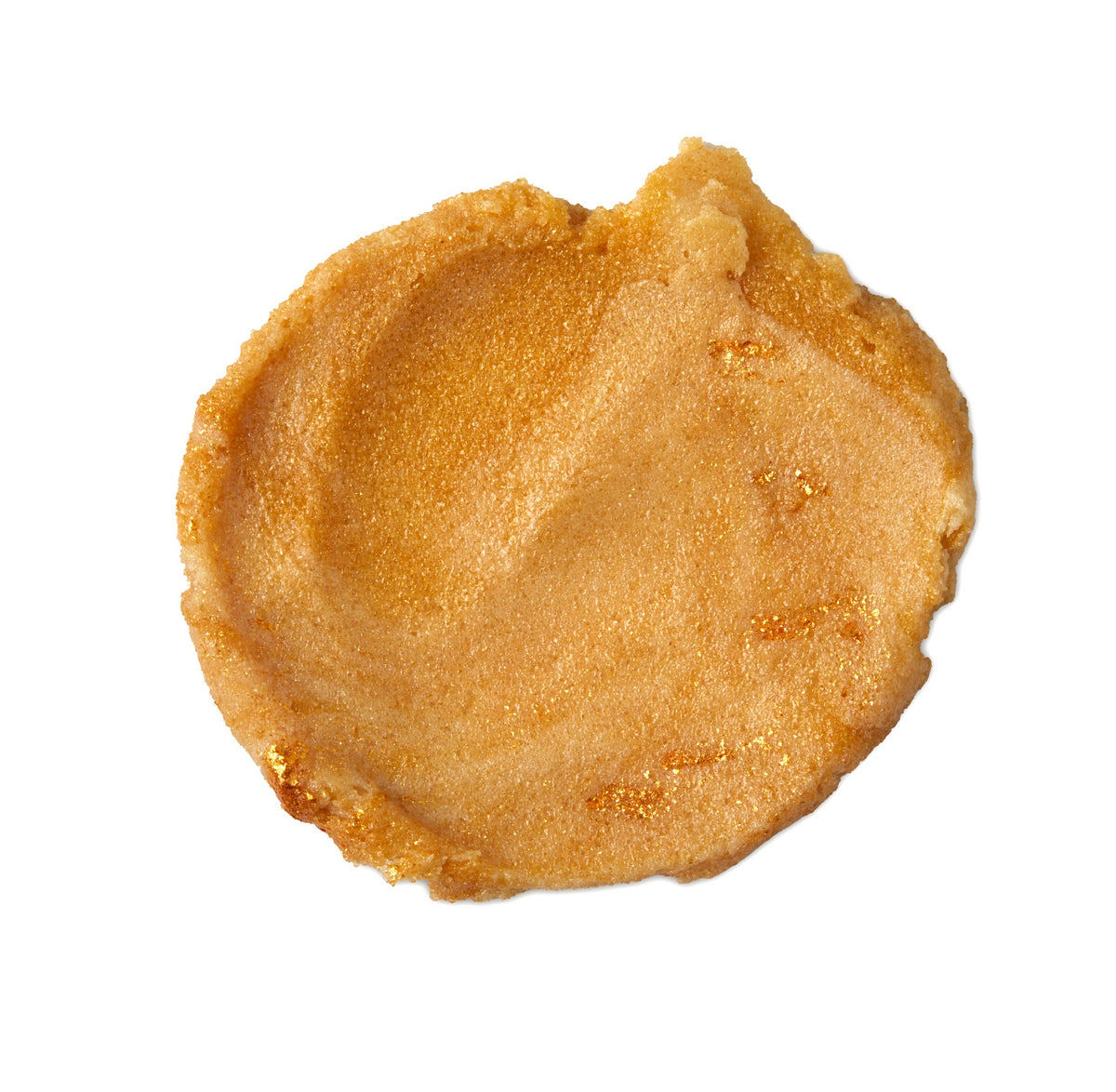 A brown circular swatch of a lush sugar scrub that smells like warm pudding. 