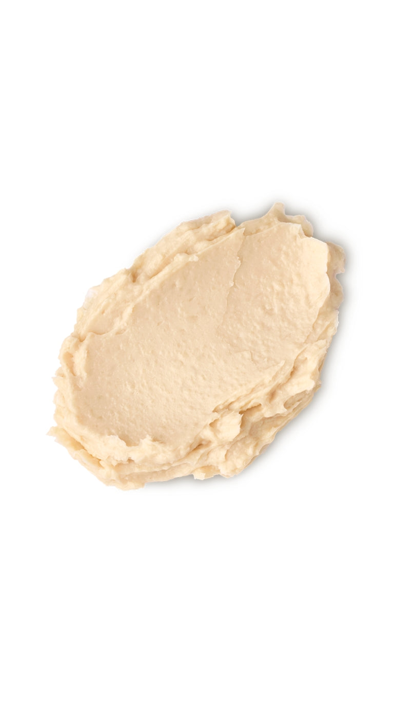 A cream oval-shaped swatch of a lush cream shampoo that smells like lemony creams. 