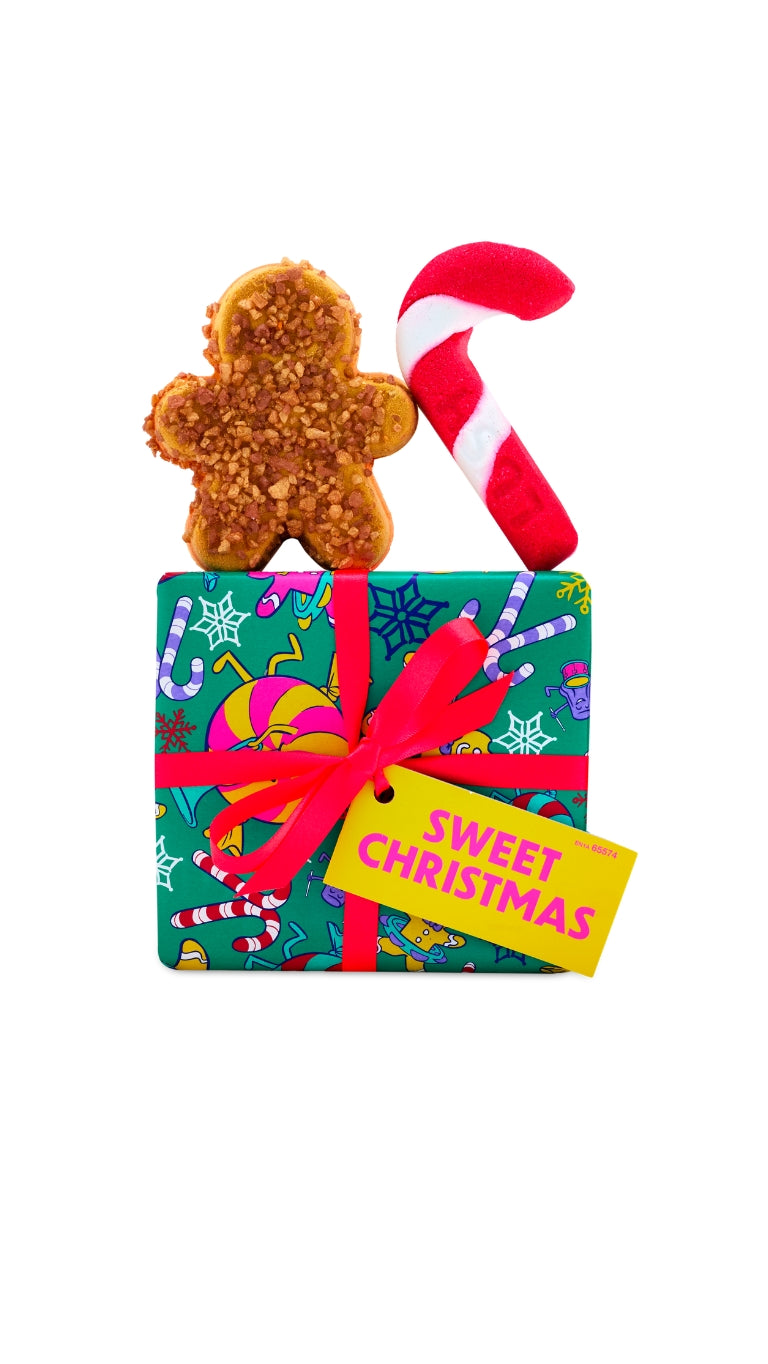 Sweet christmas gift featuring gingerbread bath bomb and candy cane bubble bar displayed on top of a graphic wrapped gift box.