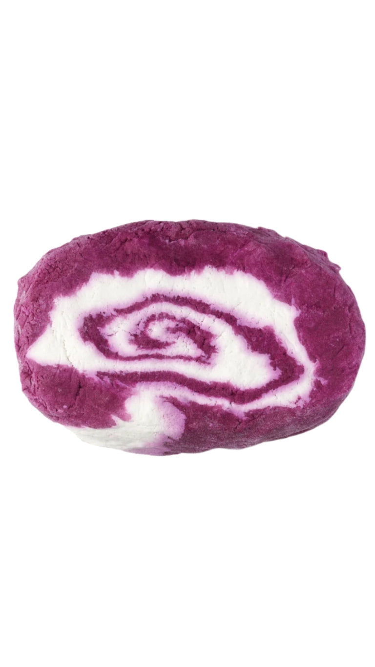 A large oval-shaped pink and white marbled bubble bar that smells like blackcurrent. 