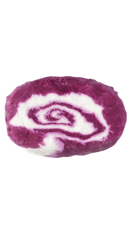 A large oval-shaped pink and white marbled bubble bar that smells like blackcurrent. 