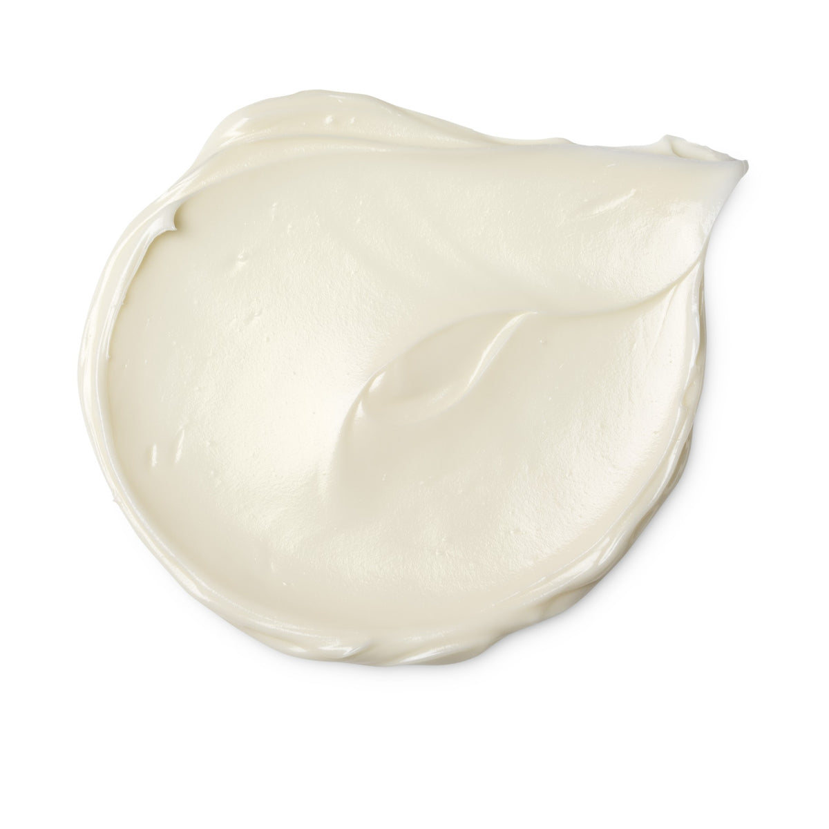 A white circular swatch of a lush cleanser .